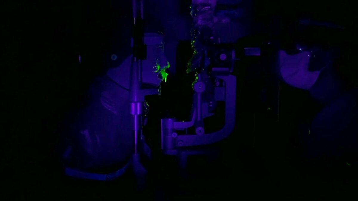 Fluorescent dye showing the spread of virus after a sneeze as demonstrated by a burst-up balloon