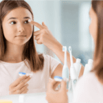 A confident girl putting on contact lenses by herself